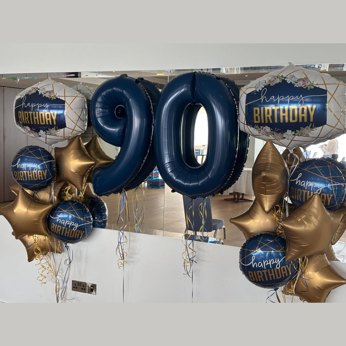 Giant Navy '90' with Birthday Supershape, 18" Birthday Foils, and Gold Sateen Foil Star Clusters