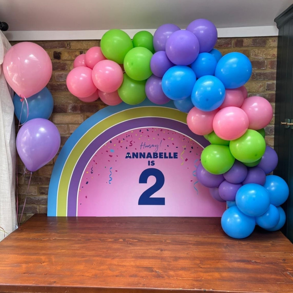 Table Top Board with Personalised Vinyl Print and Pink, Lime Green, Blue & Lilac Balloon Garland