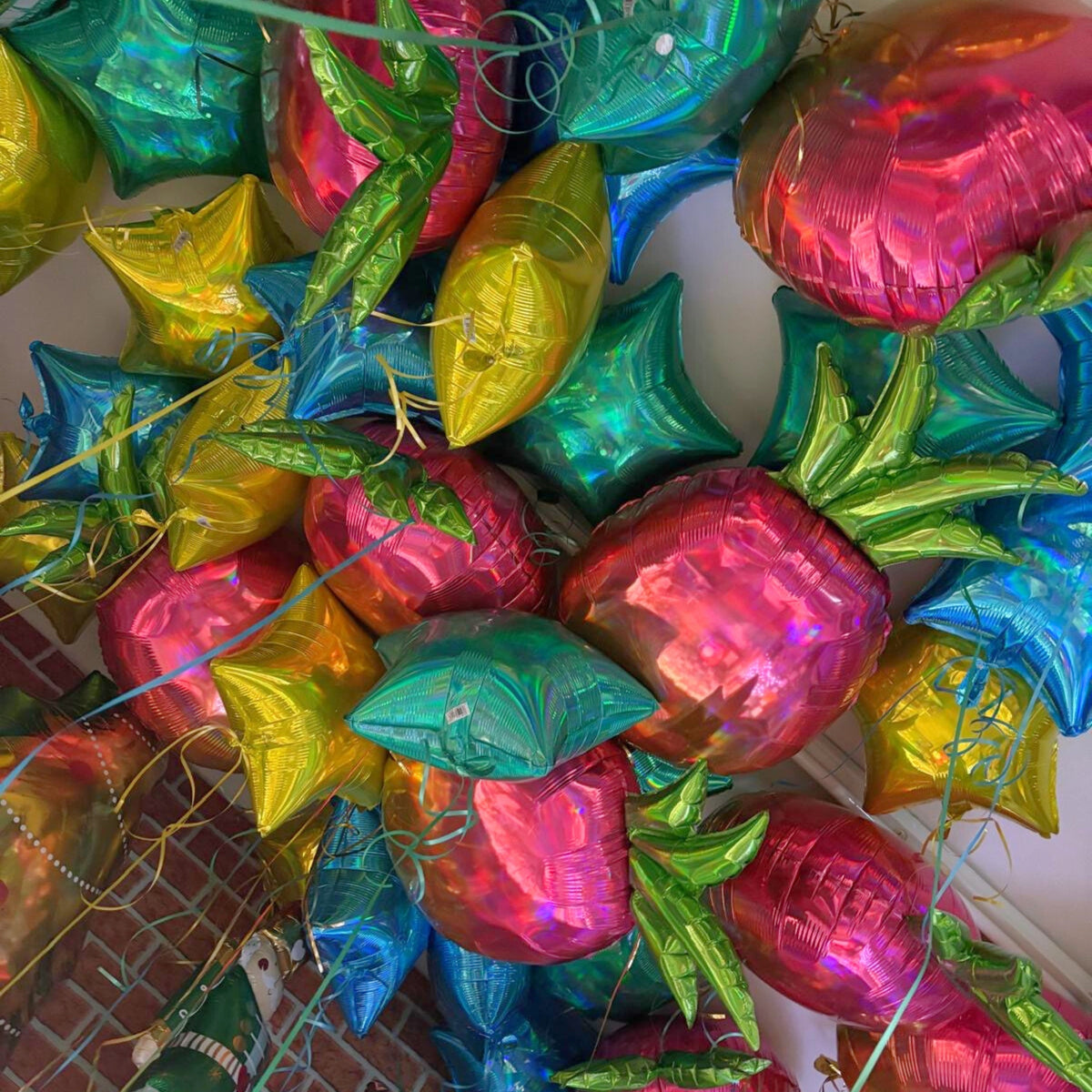 Helium-Filled Foil Balloon Ceiling Display with Iridescent Plain Foil Stars & Pineapple Supershapes